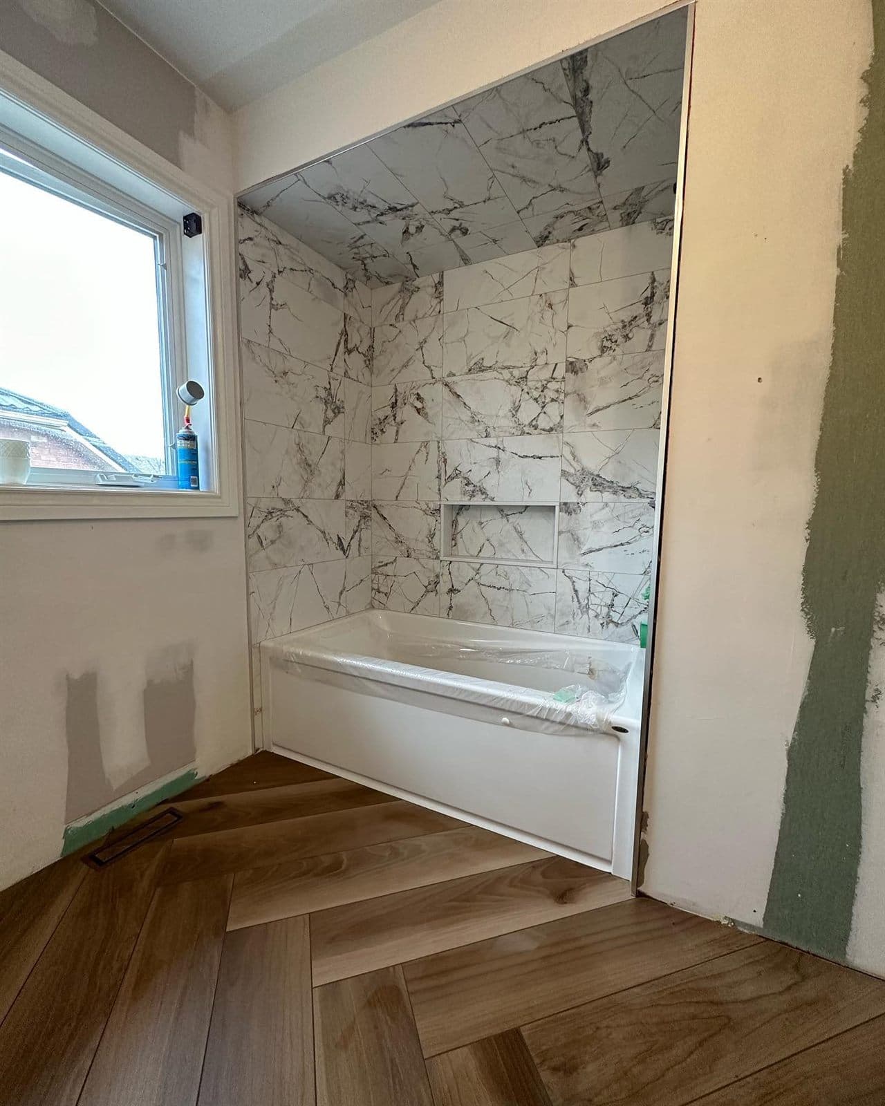Marble Tub Surround & Herringbone Floor — Bathrooms in Toronto, ON